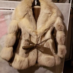 Fox fur with leather trim jacket.